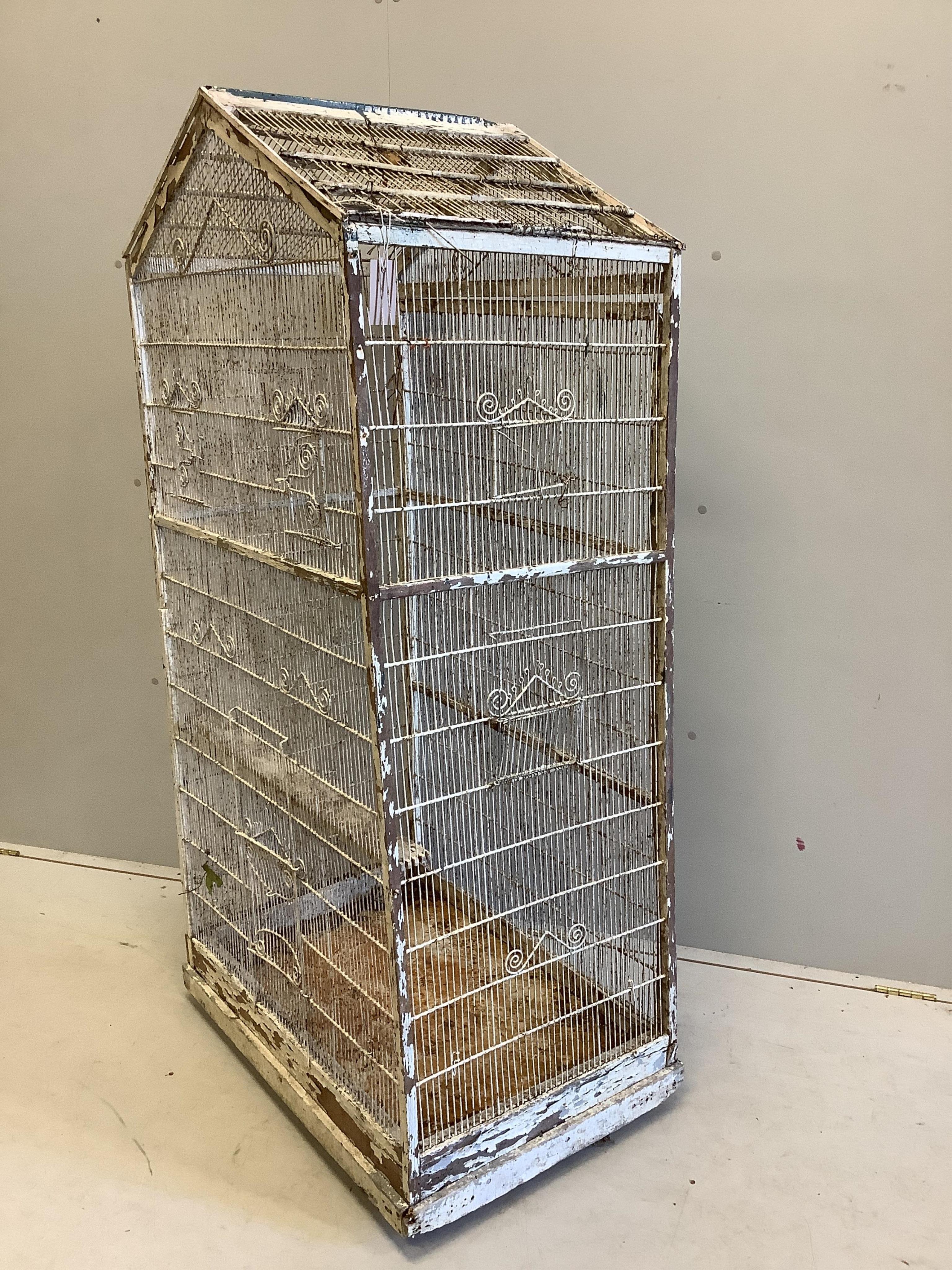 A large vintage wirework birdcage, width 75cm, depth 50cm, height 152cm. Condition - poor